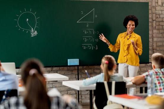 Teacher in front of classroom of children